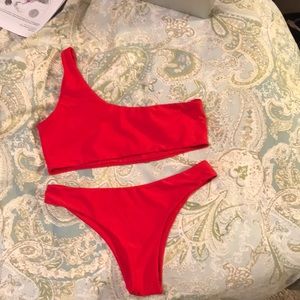Red one-shoulder swim suit
